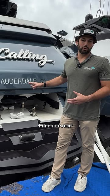 Certified installer applying Yacht Armor paint protection film
